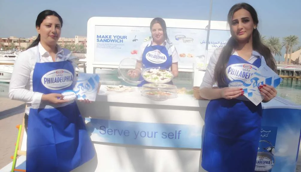 Philadelphia promoters presenting product samples at a branded tasting stand